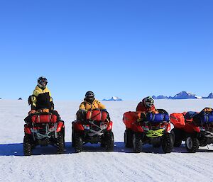 Four quad bikes on the plateau with the Framnes Mountains in the background