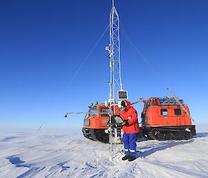 A computer is plugged into the automatic weather station to check its serviceability