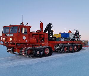 The pioneer fully loased with 2 sleds on the tray and towing a sled of fuel drums