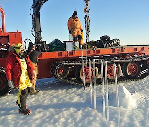 removing poles that mark the edges of the Ski Landing Area