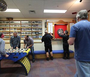 Played side by side is table soccer and darts