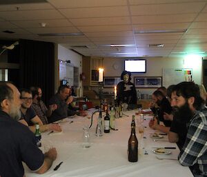 The station seated at the dinner table tasting the whiskies matched to each course