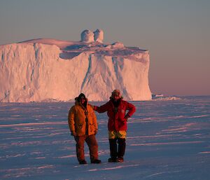 Robbie and Charlie with a iceberg in the background spectacular