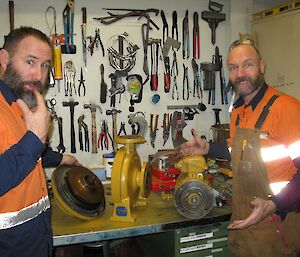 Charlie and Evan have dismantled the pump and look confused