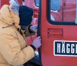 Robbie is repairing the door latch on the Hägglunds