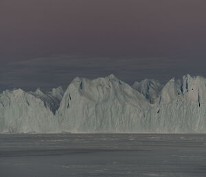 The stark white ice cliffs in the morning light