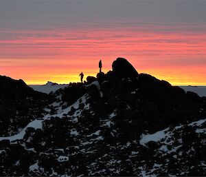 Angus and Kim on top of a hill at Colbeck watching the sun set.