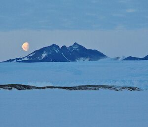 Driving back to station ocross the sea ice we see the moon rising over Mt Henderson.