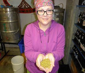 Kate with a handfull of tasty hops.