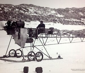 Old image of a small plane, called an air tractor, on the sea ice with pilot/driver.