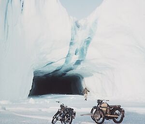 A BSA Bantam Major 150cc and Triumph 650cc near Mawson 1964 with an ice cave in the background.