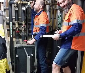 Evan and Charlie doing annual inspections in the basement where it is nice and warm and out of the blizzard.