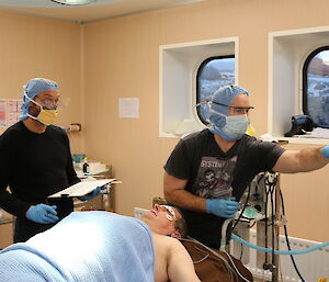 Expeditioners monitor pretend patient John’s vital signs during training.