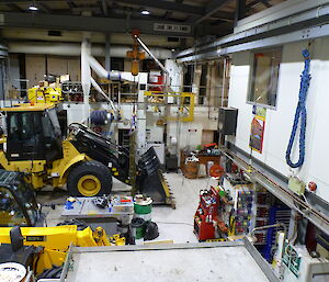A couple of vehicles and lots of equipment inside the large workshop known as ‘Red Dwarf'.
