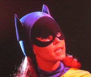 A close up picture of batgirl delivering dialog.