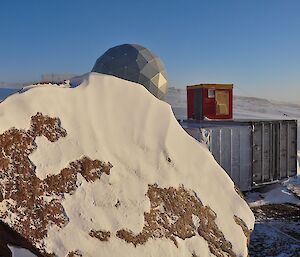 A view of the ANARESAT dome which is our link back to Australia and storage containers.