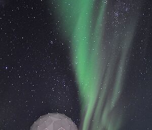 The night sky over the ANARESAT with a Aurora Australis lighting up the sky.