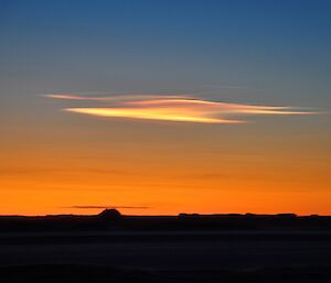 Stratosperic clouds look like brush stroked lines in sunset