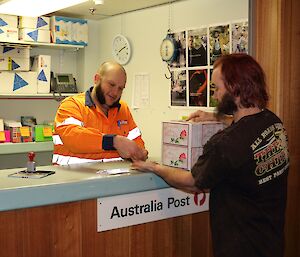 An expeditioner sending a parcel home to mum.