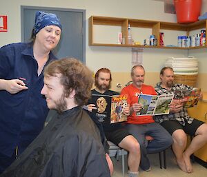 Some strange characters waiting in line for the hair dresser.