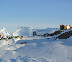 The two huts on Macey Island a red apple hut and steel main hut..