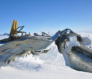 The remains of the plane with the David Ranges in the background
