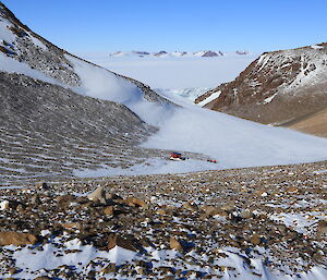 Fang hut, with the South Masson Range in the distance photo taken from the ridge behind the hut.