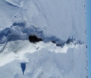 A crack in the ice that is extremely long, with no end in sight.