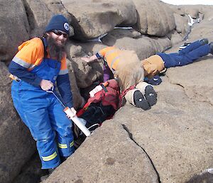 Trev pumping the air out of the Ferno vacuum mattress prior to lifting the patient onto the stretcher.