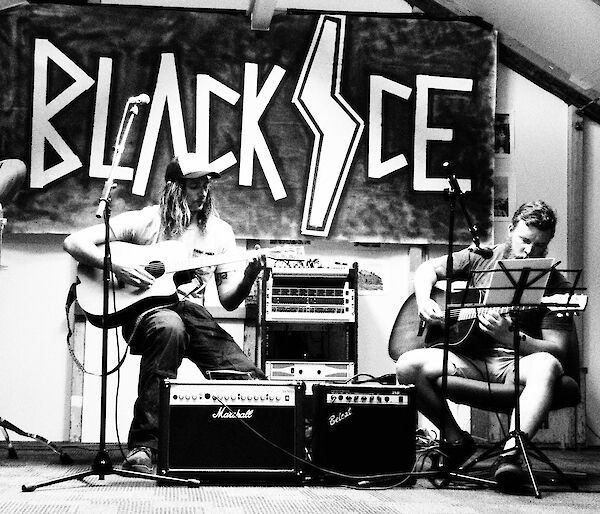 A black and white image of James and Sam opening with an acoustic set.