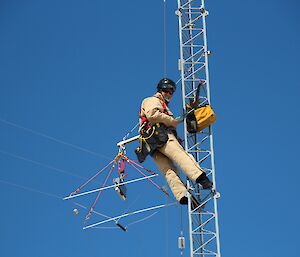 Paul installing the new HF antenna half way up the mast.