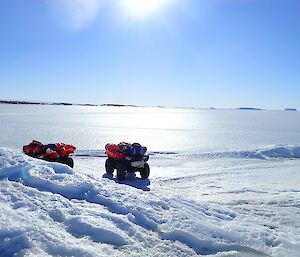 Quads on the ice, parked on the snowy edges of the islands out from Mawson.