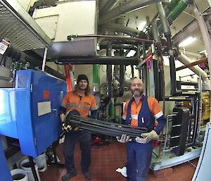 James and Charlie removing an element from an electric boiler.