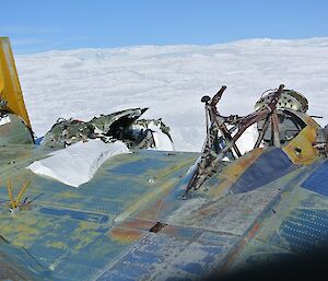 Wreck of Russian aircraft on icy plateau.