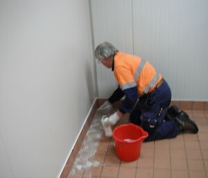 Tony scrubbing the floor