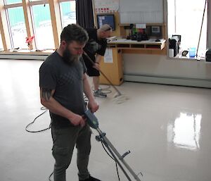 Sam and Paul polishing the floors