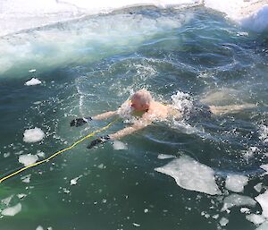 John swimming with rope and ice
