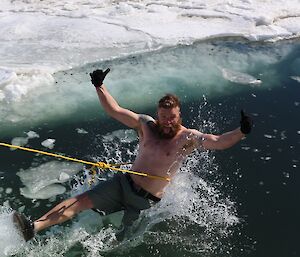 Sam falling backwards into the water he does look happy.