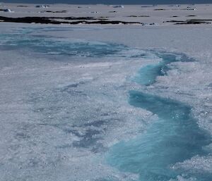 The melt in summer with streams appearing on the plateau.