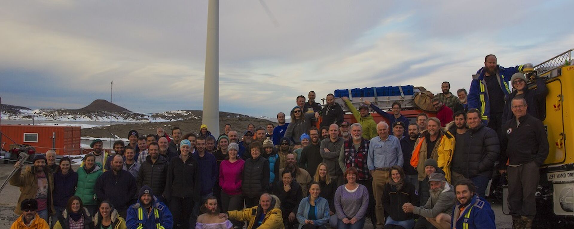A group of 75 people standing next to two Hägglunds