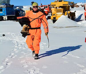 A man in a orange dry suit