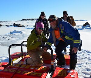 Four men around a floating raft