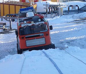 Hägglunds at bottom of snow bank