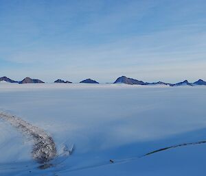 A view across an ice plateau towards Mountain Ranges