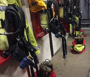 A row of boots, coats and breathing apparatus