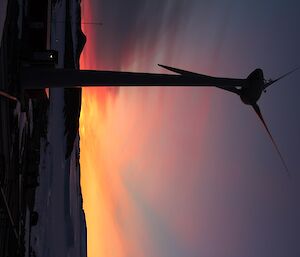 sunrise with a windturbine in front