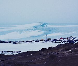 Mawson Station in the distance with a glacier behind it