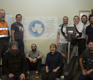 a group of people with a treadmill in the middle