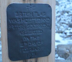 A steel plaque on a pole