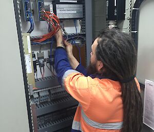 a man in an electrical cupboard